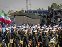 An Iranian Khoramshahr ballistic missile is carried by a truck during a military parade commemorating the anniversary of the Iran-Iraq War (...