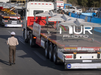 Iranian-made unmanned aerial vehicles (UAV), the Shahed-136, which are equipped with jet engines, are carried by a truck during a military p...