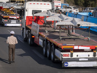 Iranian-made unmanned aerial vehicles (UAV), the Shahed-136, which are equipped with jet engines, are carried by a truck during a military p...