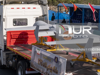 Iranian-made unmanned aerial vehicles (UAV), the Shahed-136B, are carried by a truck during a military parade commemorating the anniversary...