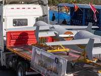 Iranian-made unmanned aerial vehicles (UAV), the Shahed-136B, are carried by a truck during a military parade commemorating the anniversary...