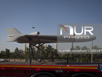 An Iranian-made unmanned aerial vehicle (UAV), the Shahed-136, which is equipped with a jet engine, is carried by a truck during a military...