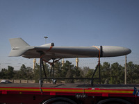 An Iranian-made unmanned aerial vehicle (UAV), the Shahed-136, which is equipped with a jet engine, is carried by a truck during a military...