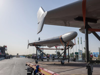 Iranian-made unmanned aerial vehicles (UAV), the Shahed-136, which are equipped with jet engines, are carried by a truck during a military p...