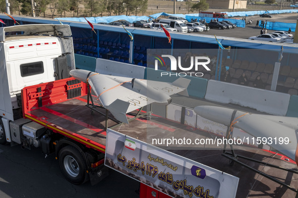 Iranian-made unmanned aerial vehicles (UAV), the Shahed-136, which are equipped with jet engines, are carried by a truck during a military p...