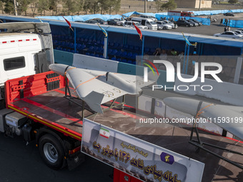 Iranian-made unmanned aerial vehicles (UAV), the Shahed-136, which are equipped with jet engines, are carried by a truck during a military p...