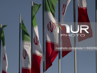 Iranian flags wave in the wind during a military parade commemorating the anniversary of the Iran-Iraq War (1980-88) outside the Khomeini Sh...