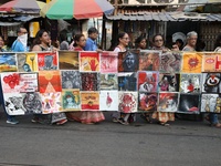 Indian artists protest with their paintings while they shout slogans during a protest rally against the rape and murder of a PGT woman docto...