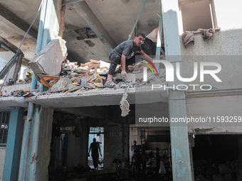 A picture shows the destruction caused by an Israeli army attack on the Al-Falah school where Palestinians take shelter, killing and woundin...