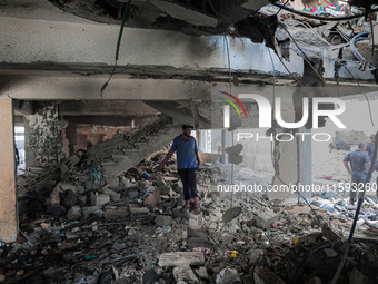 A picture shows the destruction caused by an Israeli army attack on the Al-Falah school where Palestinians take shelter, killing and woundin...