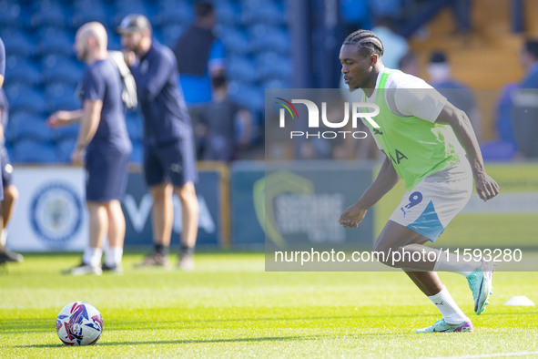 Tanto Olaofe #9 of Stockport County F.C. warms up during the Sky Bet League 1 match between Stockport County and Leyton Orient at the Edgele...