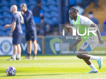 Tanto Olaofe #9 of Stockport County F.C. warms up during the Sky Bet League 1 match between Stockport County and Leyton Orient at the Edgele...