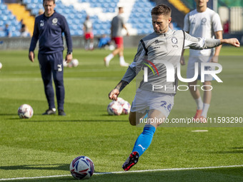 Oliver Norwood #26 of Stockport County F.C. warms up during the Sky Bet League 1 match between Stockport County and Leyton Orient at the Edg...