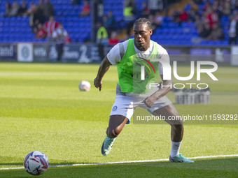 Tanto Olaofe #9 of Stockport County F.C. warms up during the Sky Bet League 1 match between Stockport County and Leyton Orient at the Edgele...