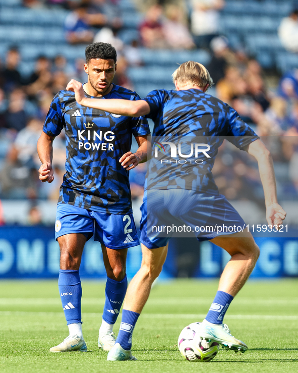 James Justin of Leicester City (facing camera) drills with Victor Kristiansen during the warm-up for the Premier League match between Leices...