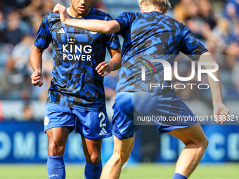 James Justin of Leicester City (facing camera) drills with Victor Kristiansen during the warm-up for the Premier League match between Leices...