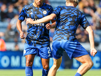 James Justin of Leicester City (facing camera) drills with Victor Kristiansen during the warm-up for the Premier League match between Leices...