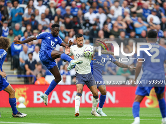 Wilfred Ndidi of Leicester City battles for possession with Dwight McNeil of Everton during the Premier League match between Leicester City...