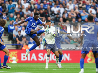 Wilfred Ndidi of Leicester City battles for possession with Dwight McNeil of Everton during the Premier League match between Leicester City...