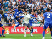 Wilfred Ndidi of Leicester City battles for possession with Dwight McNeil of Everton during the Premier League match between Leicester City...