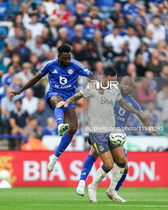 Wilfred Ndidi of Leicester City battles for possession with Dwight McNeil of Everton during the Premier League match between Leicester City...