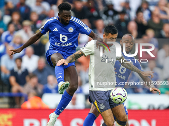 Wilfred Ndidi of Leicester City battles for possession with Dwight McNeil of Everton during the Premier League match between Leicester City...