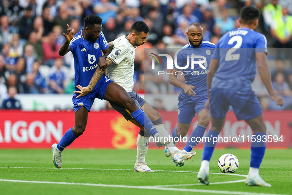 Wilfred Ndidi of Leicester City battles for possession with Dwight McNeil of Everton during the Premier League match between Leicester City...