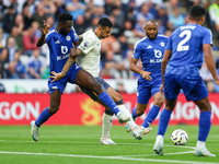 Wilfred Ndidi of Leicester City battles for possession with Dwight McNeil of Everton during the Premier League match between Leicester City...