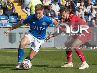 Callum Camps #8 of Stockport County F.C. possesses the ball during the Sky Bet League 1 match between Stockport County and Leyton Orient at...