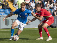 Callum Camps #8 of Stockport County F.C. possesses the ball during the Sky Bet League 1 match between Stockport County and Leyton Orient at...