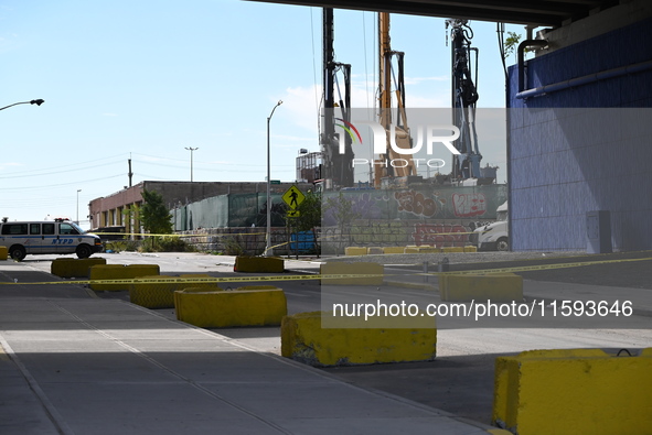 The NYPD investigates and expands the crime scene to an underpass near the site of a mass shooting on Stewart Avenue and Cherry Street in Br...