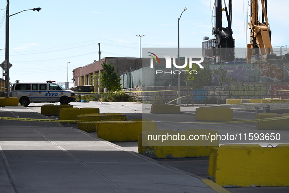 The NYPD investigates and expands the crime scene to an underpass near the site of a mass shooting on Stewart Avenue and Cherry Street in Br...