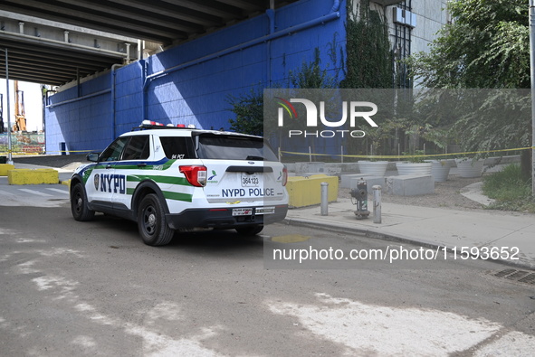 The NYPD investigates and expands the crime scene to an underpass near the site of a mass shooting on Stewart Avenue and Cherry Street in Br...