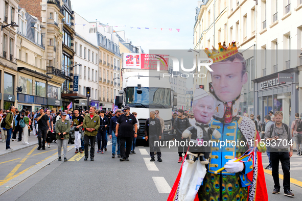 Michel Barnier and Emmanuel Macron caricature during a protest against the ''Macron-Barnier'' government, in Paris, on September 21, 2024. F...