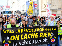 People during a protest against the ''Macron-Barnier'' government, in Paris, on September 21, 2024. France's new premier said he hoped to fi...