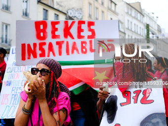 People during a protest against the ''Macron-Barnier'' government, in Paris, on September 21, 2024. France's new premier said he hoped to fi...