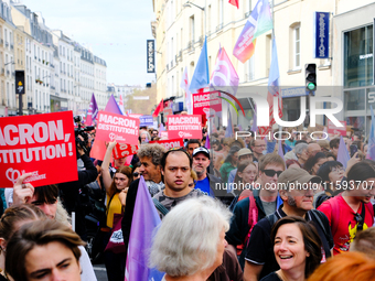 People during a protest against the ''Macron-Barnier'' government, in Paris, on September 21, 2024. France's new premier said he hoped to fi...