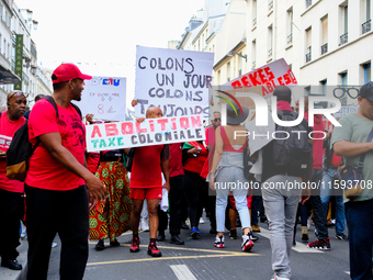 People during a protest against the ''Macron-Barnier'' government, in Paris, on September 21, 2024. France's new premier said he hoped to fi...