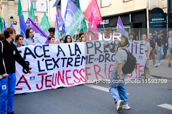 People during a protest against the ''Macron-Barnier'' government, in Paris, on September 21, 2024. France's new premier said he hoped to fi...