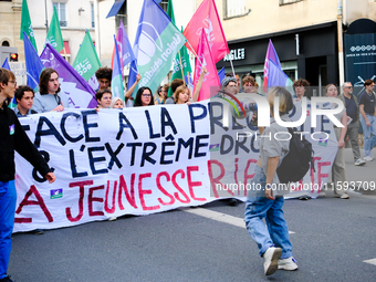 People during a protest against the ''Macron-Barnier'' government, in Paris, on September 21, 2024. France's new premier said he hoped to fi...