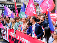 People during a protest against the ''Macron-Barnier'' government, in Paris, on September 21, 2024. France's new premier said he hoped to fi...