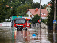 A fire truck drives in the water after Nysa Klodzka river flooded town of Lewin Brzeski in southwestern Poland, on September 19th, 2024. Sto...