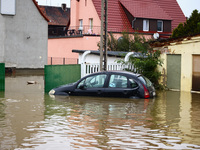 A car is seen in the water after Nysa Klodzka river flooded town of Lewin Brzeski in southwestern Poland, on September 19th, 2024. Storm Bor...