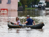 Residents swim on a raft after Nysa Klodzka river flooded town of Lewin Brzeski in southwestern Poland, on September 19th, 2024. Storm Boris...