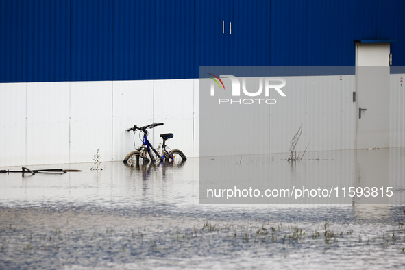 A bicycle is seen in the water after Nysa Klodzka river flooded town of Lewin Brzeski in southwestern Poland, on September 19th, 2024. Storm...