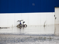 A bicycle is seen in the water after Nysa Klodzka river flooded town of Lewin Brzeski in southwestern Poland, on September 19th, 2024. Storm...