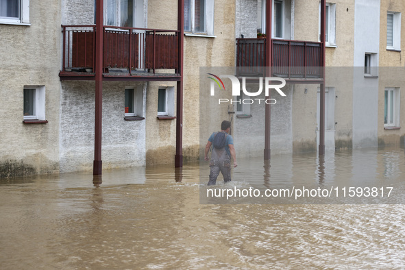 A man walks in the water after Nysa Klodzka river flooded town of Lewin Brzeski in southwestern Poland, on September 19th, 2024. Storm Boris...