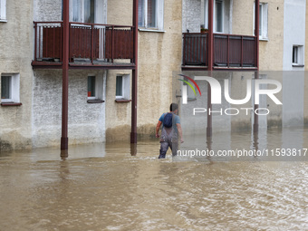 A man walks in the water after Nysa Klodzka river flooded town of Lewin Brzeski in southwestern Poland, on September 19th, 2024. Storm Boris...