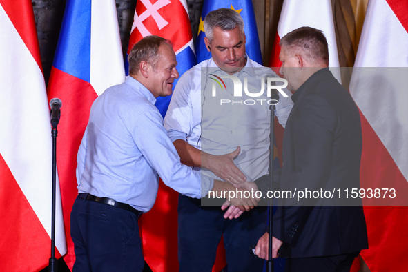 Polish Prime Minister Donald Tusk, Austrian Chacellor Karl Nehammer and Slovak Prime Minister Robert Fico attend a press conference at the t...