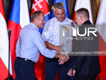 Polish Prime Minister Donald Tusk, Austrian Chacellor Karl Nehammer and Slovak Prime Minister Robert Fico attend a press conference at the t...